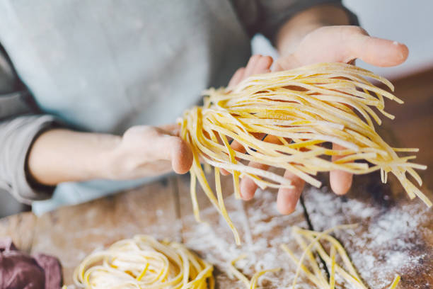 Chef making fresh italian pasta stock photo