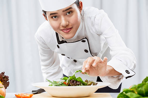 chef preparing salad stock photo