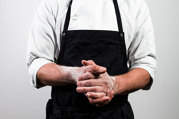 chef with flour on hands chef with flour on hands apron stock pictures, royalty-free photos & images