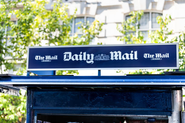 Chelsea street with closeup of sign on square for dailymail daily mail newsstand newspaper magazine stand news blue color stock photo