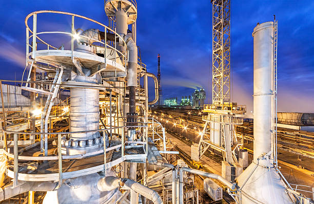 Chemical plant for production of ammonia and nitrogen fertilization Chemical plant for production of ammonia and nitrogen fertilization on night time. ammonia stock pictures, royalty-free photos & images