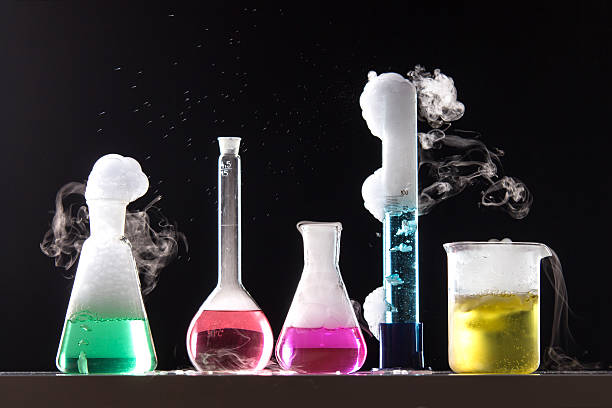 Chemical Reaction The chemical reaction runs in laboratory glassware chemical reaction stock pictures, royalty-free photos & images