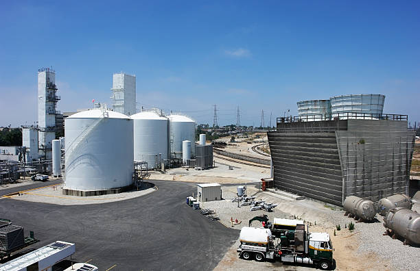 a chemical refinery plant with blue skies - green hydrogen bildbanksfoton och bilder
