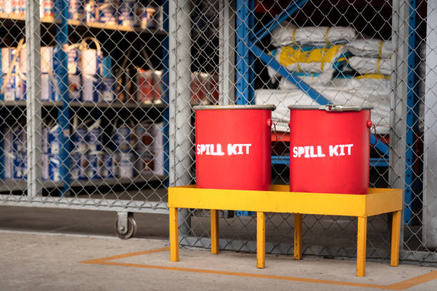 Chemical spill kit. Spill kit containment boxes are prepared and placed in front of the chemical storage room. Using in emergency case of chemical spill or leak on ground. spilling stock pictures, royalty-free photos & images