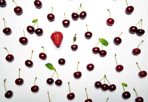 cherries and strawberries on a white background stock photo