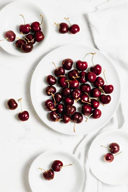 Cherries on plates stock photo