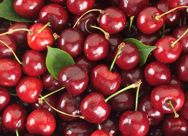 Cherries sweet with stem and Leafs stock photo