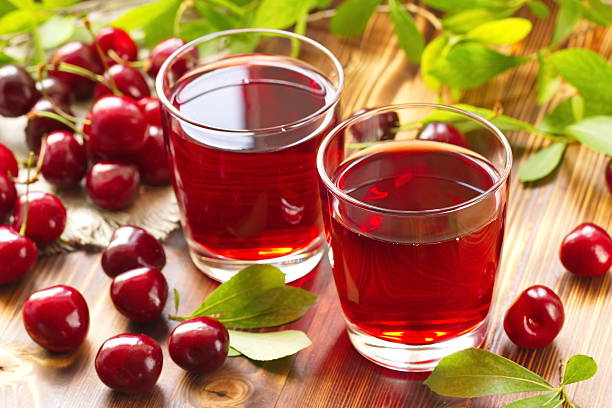 Cherry juice with fresh berries Cherry juice with fresh berries sour taste stock pictures, royalty-free photos & images