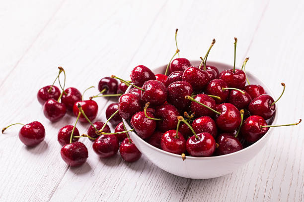 cherry fresh cherry on white wooden table cherry stock pictures, royalty-free photos & images