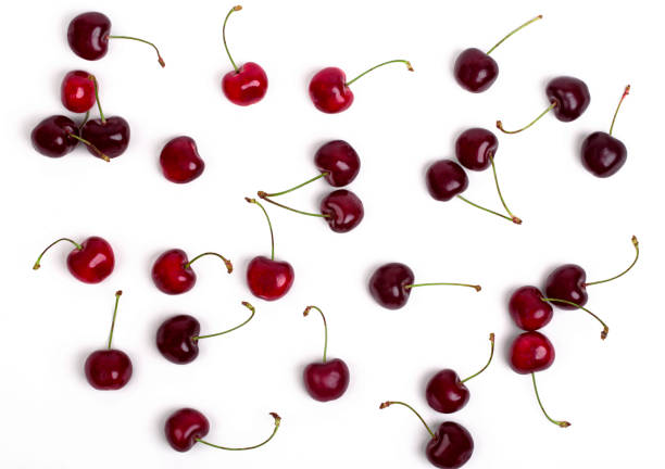 cherry Cherry scattered on a white background, top view cherry stock pictures, royalty-free photos & images
