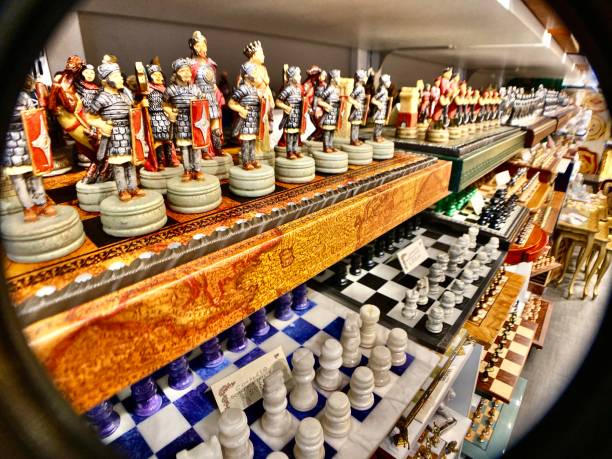 chess boards for sale - a local vendor shows his wares in a shop located on the ponte vecchio, florence, tuscany, italy. stock photo