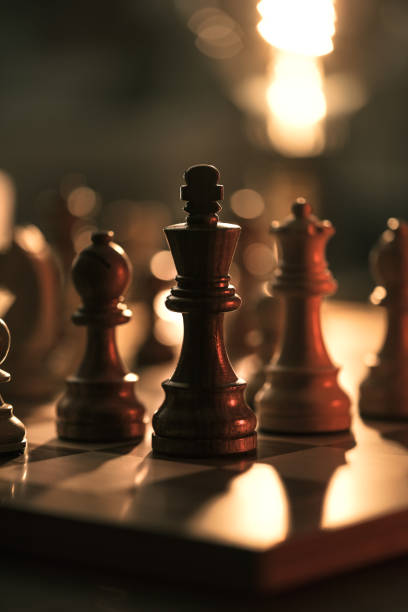 Chess pieces on the chessboard stock photo