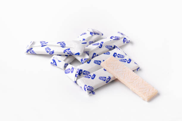Chewing gum in a foil wrapper on a white background. Group of chewing gums Chewing gum in a foil wrapper on a white background. Group of chewing gums. Beautiful photo chewy stock pictures, royalty-free photos & images