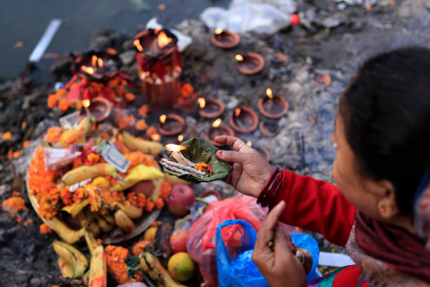 Chhath parba in pictures Devotees offering rituals to the sun god during chhath festival in Kamal Pokhari,Kathmandu, Nepal on 2019/11/03. chhath stock pictures, royalty-free photos & images