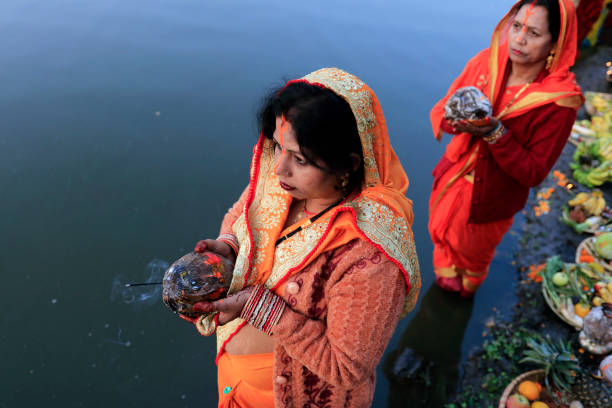 Chhath parba in pictures Devotees offering rituals to the sun god during chhath festival in Kamal Pokhari,Kathmandu, Nepal on 2019/11/03. chhath stock pictures, royalty-free photos & images