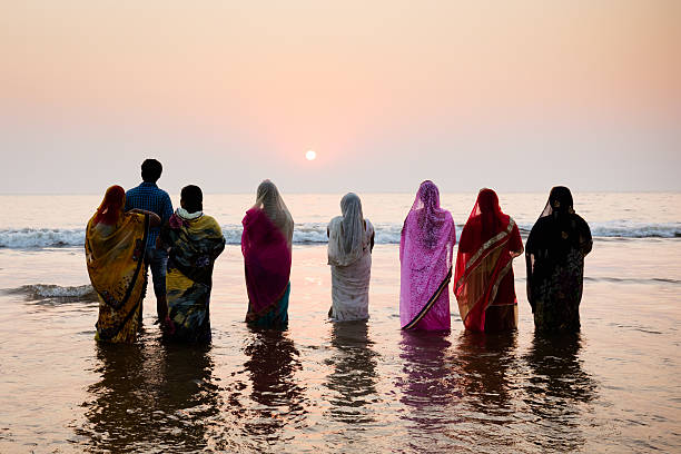 Chhath Puja Festival 2016 Mumbai, India - November 6, 2016: Mumbai, India - 6 November: The ancient Hindu Chhath Puja Festival being celebrated on Juhu Beach in Mumbai on 6th November 2016. chhath stock pictures, royalty-free photos & images