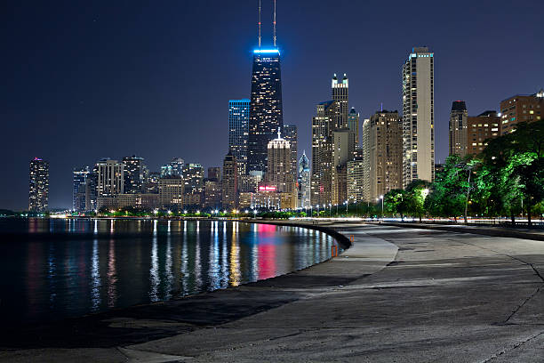 Chicago Skyline. Image of the Chicago downtown lakefront at night. local landmark stock pictures, royalty-free photos & images