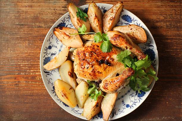 Chicken baked with pears stock photo