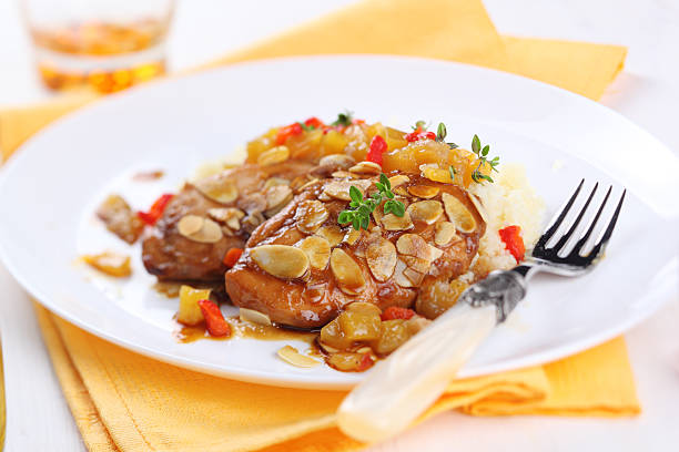 Chicken breast baked with almonds and apricot sauce stock photo