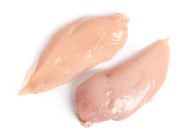 chicken breast. isolated on a white background. directly above. - rauw stockfoto's en -beelden