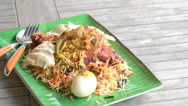 Chicken Briyani rice on table. An Indian cuisine. Side view. Copy space. stock photo