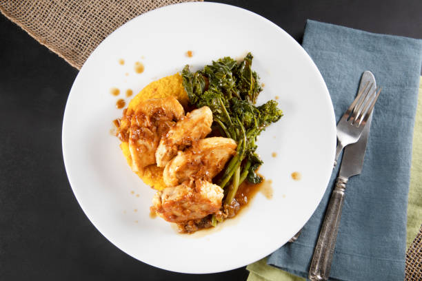 Chicken Dinner Flat Lay Chicken breast medallions with shallot marsala gravy, polenta and broccoli rabe broccoli rabe stock pictures, royalty-free photos & images