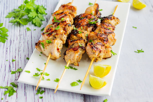 Chicken Kebabs on a White Platter stock photo