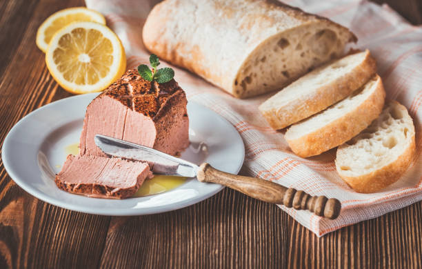 Chicken liver pate on the white plate Chicken liver pate with ciabatta on the white plate liver pâté photos stock pictures, royalty-free photos & images
