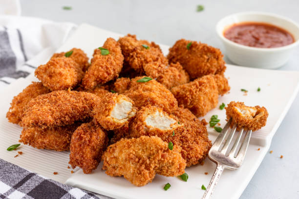 Chicken Nuggets with Ketchup, Popular American Fast Food, Snack, Quick Bites, Appetizer stock photo