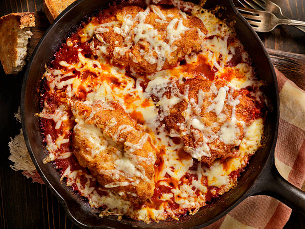 Chicken Parmesan Baked in Tomato Sauce with Mozzarella Cheese Chicken Parmesan Baked in Tomato Sauce with Mozzarella Cheese- Photographed on a Hasselblad H3D11-39 megapixel Camera System parmesan cheese stock pictures, royalty-free photos & images