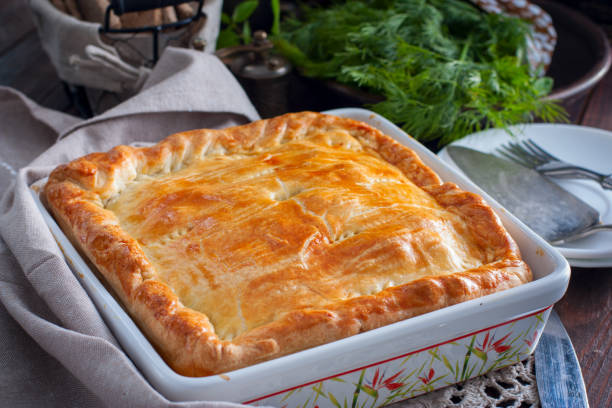 Chicken, potato and onion puff pastry cake, selective focus Chicken, potato and onion puff pastry cake, selective focus meat pie stock pictures, royalty-free photos & images