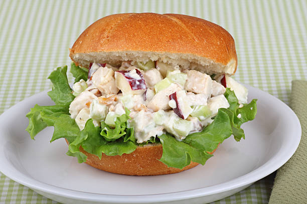 Chicken Salad Sandwich Chicken salad sandwich with apple pieces on top of lettuce chicken salad stock pictures, royalty-free photos & images