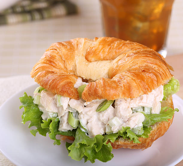 Chicken Salad Sandwich Chicken salad with lettuce on a croissant roll chicken salad stock pictures, royalty-free photos & images