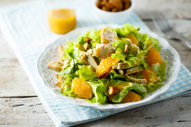 Chicken salad with orange Homemade chicken salad with orange and almond chicken salad stock pictures, royalty-free photos & images