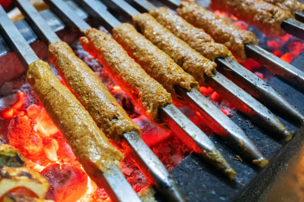 Chicken seekh kababs are being prepared road side stock photo