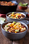 Bowl of Chicken Tortilla Soup (or Taco Soup) with Cheddar Cheese and Avocado