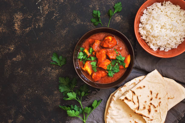 Chicken tikka masala with rice. Indian food. Top view, copy space. Chicken tikka masala with rice. Indian food. Top view, copy space naan bread stock pictures, royalty-free photos & images