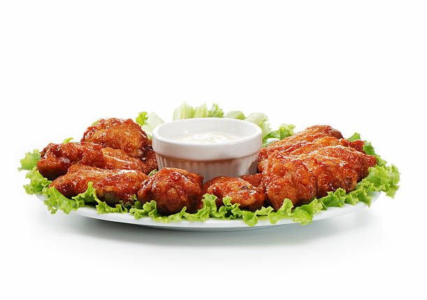 Chicken wings served on a plate with a dip  stock photo