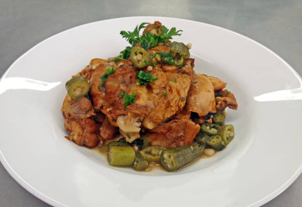 Chicken with okra A plate of cooked chicken with okra okra photos stock pictures, royalty-free photos & images