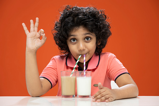 happy, child, drinking, milk, chocolate shake, India, Indian ethnicity,