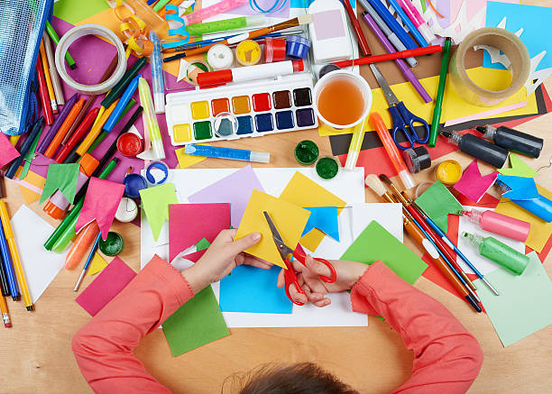 child drawing top view. artwork workplace with creative accessories. - kunstnijverheid stockfoto's en -beelden