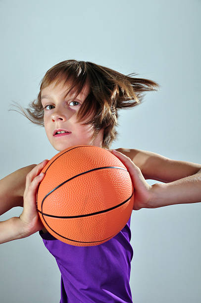 child exercising with ball stock photo