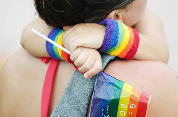 Child Hugging Mother at Miami Beach Gay Pride Parade 2018 stock photo