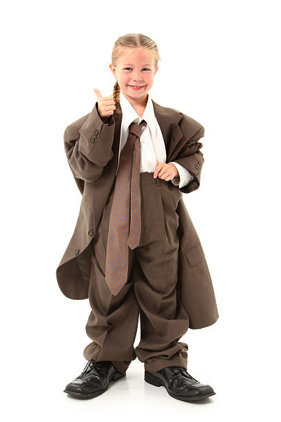 Child in Oversized Suit Beautiful  american four year old girl dressed in oversized business suit. oversized object stock pictures, royalty-free photos & images
