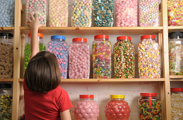 child in sweet shop  pick and mix stock pictures, royalty-free photos & images