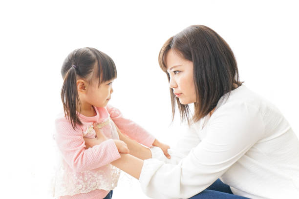 Child parenting image Child parenting image asian mother talking with daughter stock pictures, royalty-free photos & images