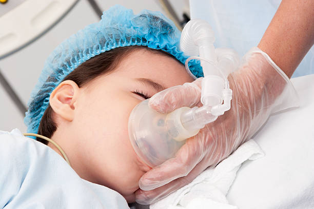 Child patient receiving artificial ventilation Portrait of child patient receiving artificial ventilation in hospital anesthetic stock pictures, royalty-free photos & images