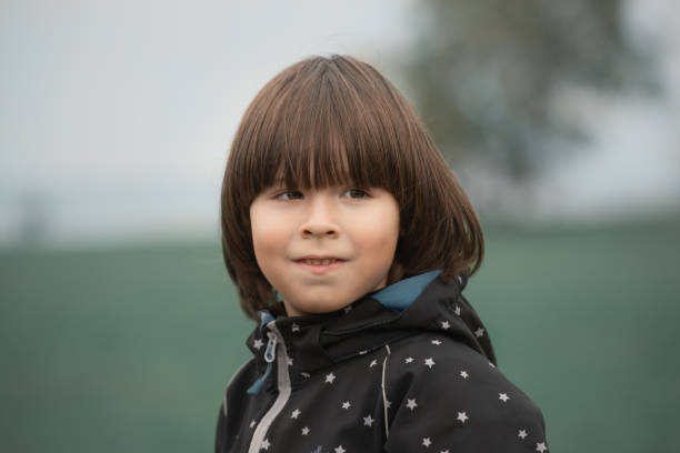 Child smiles portrait on blurry background stock photo