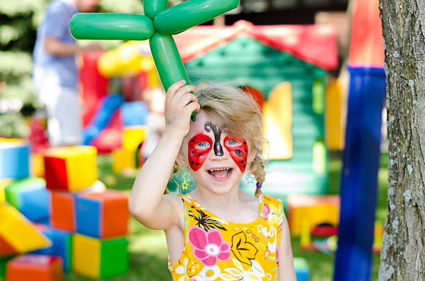 child with face painting stock photo