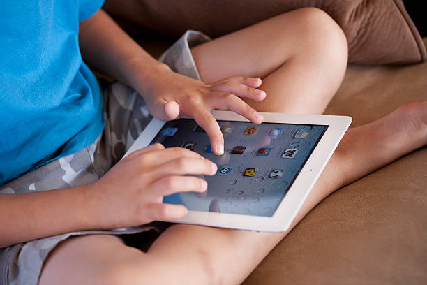 Child With iPad 2 stock photo
